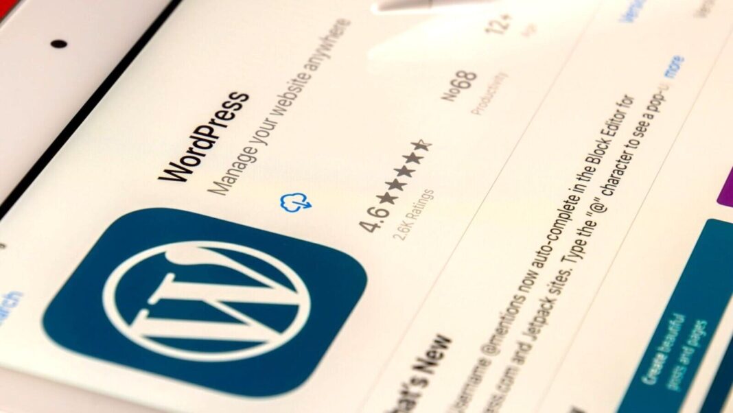 An iPad with WordPress admin screen visible